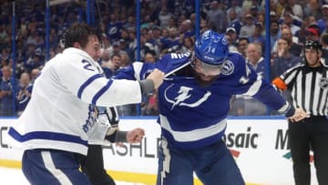 Apr 11, 2023; Tampa, Florida, USA; Tampa Bay Lightning left wing Pat Maroon (14) and Toronto Maple Leafs defenseman Luke Schenn (2) fight during the first period at Amalie Arena. Mandatory Credit: Kim Klement-USA TODAY Sports