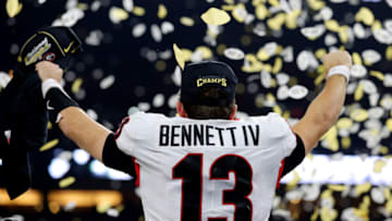 INDIANAPOLIS, INDIANA - JANUARY 10: Stetson Bennett #13 of the Georgia Bulldogs celebrates after the Georgia Bulldogs defeated the Alabama Crimson Tide 33-18 in the 2022 CFP National Championship Game at Lucas Oil Stadium on January 10, 2022 in Indianapolis, Indiana. (Photo by Kevin C. Cox/Getty Images)