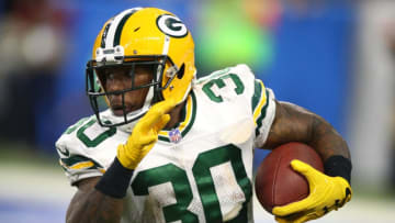 DETROIT, MI - DECEMBER 29: Jamaal Williams #30 of the Green Bay Packers runs for yardage against the Detroit Lions during the first half at Little Caesars Arena on December 29, 2017 in Detroit, Michigan. (Photo by Gregory Shamus/Getty Images)