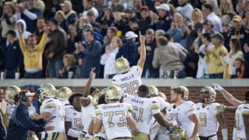 ATLANTA, GA - NOVEMBER 17: Place kicker Wesley Wells #38 of the Georgia Tech Yellow Jackets celebrates with teammates after kicking a field goal during the fourth quarter in their game against the Virginia Cavaliers at Bobby Dodd Stadium on November 17, 2018 in Atlanta, Georgia. (Photo by Michael Chang/Getty Images)