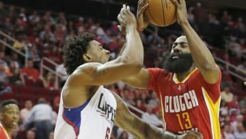 Mar 16, 2016; Houston, TX, USA; Houston Rockets guard James Harden (13) drives against Los Angeles Clippers center DeAndre Jordan (6) in the first quarter at Toyota Center. Mandatory Credit: Thomas B. Shea-USA TODAY Sports