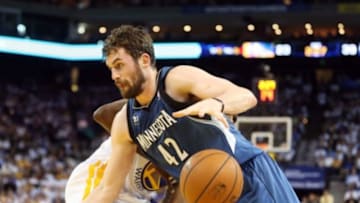 Apr 14, 2014; Oakland, CA, USA; Minnesota Timberwolves forward Kevin Love (42) loses the ball against Golden State Warriors forward Draymond Green (23) during the first quarter at Oracle Arena. Mandatory Credit: Kelley L Cox-USA TODAY Sports
