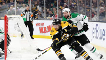 BOSTON, MA - NOVEMBER 5: Roman Polak #45 of the Dallas Stars defends Patrice Bergeron #37 of the Boston Bruins during the first period at TD Garden on November 5, 2018 in Boston, Massachusetts. (Photo by Maddie Meyer/Getty Images)