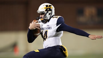 AKRON, OH - NOVEMBER 21: Kent State Golden Flashes quarterback Dustin Crum (14) runs the football during the third quarter of the college football game between the Kent State Golden Flashes and the Akron Zips on November 21, 2017, at Summa Field at InfoCision Stadium in Akron, OH. Akron defeated Kent State 24-14 to win the MAC East Division and advance to the MAC Championship game. (Photo by Frank Jansky/Icon Sportswire via Getty Images)