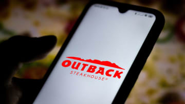 BRAZIL - 2020/07/07: In this photo illustration the Outback Steakhouse logo seen displayed on a smartphone. (Photo Illustration by Rafael Henrique/SOPA Images/LightRocket via Getty Images)
