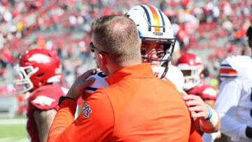Auburn footballOct 16, 2021; Fayetteville, Arkansas, USA; Auburn Tigers head coach Bryan Harsin congratulates quarterback Bo Nix (10) after the game against the Arkansas Razorbacks at Donald W. Reynolds Razorback Stadium. Auburn won 38-23. Mandatory Credit: Nelson Chenault-USA TODAY Sports