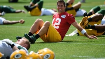 Jun 17, 2014; Green Bay, WI, USA; Green Bay Packers quarterback Aaron Rodgers stretches during the team