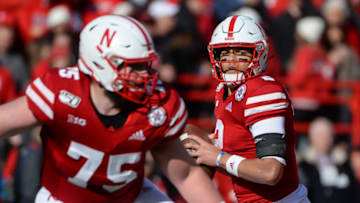 LINCOLN, NE - NOVEMBER 16: Quarterback Adrian Martinez #2 of the Nebraska Cornhuskers drops back to pass with offensive lineman Trent Hixson #75 against the Wisconsin Badgers at Memorial Stadium on November 16, 2019 in Lincoln, Nebraska. (Photo by Steven Branscombe/Getty Images)