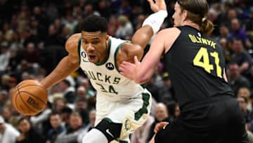 SALT LAKE CITY, UTAH - MARCH 24: Giannis Antetokounmpo #34 of the Milwaukee Bucks drives around Kelly Olynyk #41 of the Utah Jazz during the first half of a game at Vivint Arena on March 24, 2023 in Salt Lake City, Utah. NOTE TO USER: User expressly acknowledges and agrees that, by downloading and or using this photograph, User is consenting to the terms and conditions of the Getty Images License Agreement. (Photo by Alex Goodlett/Getty Images)