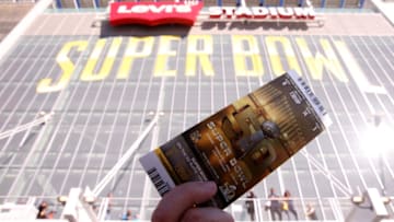 SANTA CLARA, CA - FEBRUARY 07: A fan holds up a ticket to Super Bowl 50 outside Levi's Stadium on February 7, 2016 in Santa Clara, California. (Photo by Andy Lyons/Getty Images)