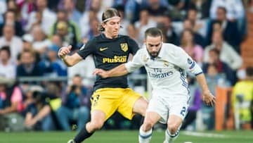 MADRID, SPAIN - MAY 02: Daniel Carvajal Ramos (r) of Real Madrid fights for the ball with Filipe Luis of Atletico de Madrid during their 2016-17 UEFA Champions League Semifinals 1st leg match between Real Madrid and Atletico de Madrid at the Estadio Santiago Bernabeu on 02 May 2017 in Madrid, Spain. (Photo by Power Sport Images/Getty Images)