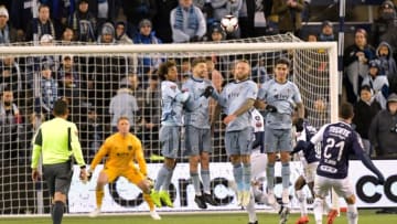 Miguel Layun of C.F Monterrey (21, right) scores over a wall of Sporting KC defenders during their CONCACAF Champions League semifinal soccer game on April 11, 2019 at Children's Mercy Park in Kansas City, Kansas. (Photo by Tim Vizer / AFP) (Photo credit should read TIM VIZER/AFP/Getty Images)
