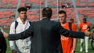Auburn football quarterback Joey Gatewood, left, and quarterback Bo Nix, right, listen to Auburn head coach Gus Malzahn game plan at Jordan-Hare Stadium in Auburn, Ala., on Saturday, Sept. 28, 2019.