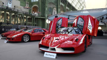 PARIS, FRANCE - FEBRUARY 04: A Ferrari FXX Evoluzione Berlinetta and a Ferrari F40 are seen during a vintage cars and motorbikes exhibition, by Bonhams auction house, at Le Grand Palais on February 4, 2015 in Paris, France. (Photo by Antoine Antoniol/Getty Images)