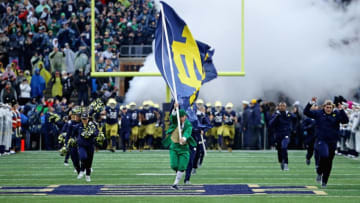 SOUTH BEND, IN - NOVEMBER 04: The macot, cheerleaders and players forthe Notre Dame Fighting Irish run onto the field before a game against the Wake Forest Demon Deacons at Notre Dame Stadium on November 4, 2017 in South Bend, Indiana. Notre Dame defeated Wake Forest 48-37. (Photo by Jonathan Daniel/Getty Images)
