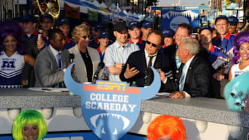 HOLLYWOOD, CA - JUNE 17: Actor Billy Crystal (seated 2nd from right) speaks to ESPN College Scoreday commentator Lee Corso at the world premiere of Disney Pixar's 'Monsters University' at the El Capitan Theatre on June 17, 2013 in Hollywood, California. (Photo by Kevin Winter/Getty Images)