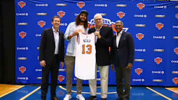 GREENSBURGH, NY - JULY 08: Joakim Noah poses with New York Knicks President Phil Jackson, General Manager Steve Mills, and Head Coach Jeff Hornacek at a press conference at the Madison Square Garden Training Facility on July 8, 2016 in Greenburgh, New York. NOTE TO USER: User expressly acknowledges and agrees that, by downloading and or using this photograph, User is consenting to the terms and conditions of the Getty Images License Agreement. Mandatory Copyright Notice: Copyright 2016 NBAE (Photo by Nathaniel S. Butler/NBAE via Getty Images)