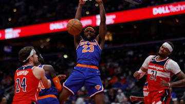 Jan 13, 2023; Washington, District of Columbia, USA; New York Knicks center Mitchell Robinson (23) dunks the ball as Washington Wizards forward Corey Kispert (24) and Wizards center Daniel Gafford (21) look on in the first quarter at Capital One Arena. Mandatory Credit: Geoff Burke-USA TODAY Sports