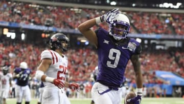 Dec 31, 2014; Atlanta , GA, USA; TCU Horned Frogs wide receiver Josh Doctson (9) celebrates a touchdown while defended by Mississippi Rebels defensive back Cody Prewitt (25) during the first half in the 2014 Peach Bowl at the Georgia Dome. Mandatory Credit: Dale Zanine-USA TODAY Sports