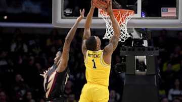 LOS ANGELES, CA - MARCH 24: Charles Matthews #1 of the Michigan Wolverines dunks the ball in the first half against Braian Angola #11 of the Florida State Seminoles in the 2018 NCAA Men's Basketball Tournament West Regional Final at Staples Center on March 24, 2018 in Los Angeles, California. (Photo by Harry How/Getty Images)