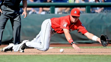 Jun 24, 2016; Omaha, NE, USA; Arizona Wildcats infielder Bobby Dalbec (3) makes a diving grab of a ground ball in the eighth inning against the Oklahoma State Cowboys in the 2016 College World Series at TD Ameritrade Park. Arizona defeated Oklahoma State 9-3. Mandatory Credit: Steven Branscombe-USA TODAY Sports