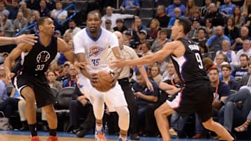 Mar 31, 2016; Oklahoma City, OK, USA; Oklahoma City Thunder forward Kevin Durant (35) drives to the basket between Los Angeles Clippers forward Wesley Johnson (33) and Los Angeles Clippers guard Pablo Prigioni (9) during the fourth quarter at Chesapeake Energy Arena. Mandatory Credit: Mark D. Smith-USA TODAY Sports