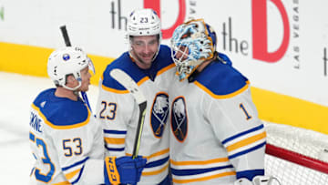 Dec 19, 2022; Las Vegas, Nevada, USA; Buffalo Sabres goaltender Ukko-Pekka Luukkonen (1) celebrates with left wing Jeff Skinner (53) and defenseman Mattias Samuelsson (23) after the Sabres defeated the Vegas Golden Knights at T-Mobile Arena. Mandatory Credit: Stephen R. Sylvanie-USA TODAY Sports
