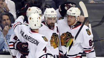 Jun 6, 2013; Los Angeles, CA, USA; Chicago Blackhawks right wing Marian Hossa (81) celebrates with teammates Patrick Sharp (10) , Niklas Hjalmarsson (4) and Johnny Oduya (27) after scoring a goal against the Los Angeles Kings in the third period of game four of the Western Conference finals of the 2013 Stanley Cup Playoffs at the Staples Center. Mandatory Credit: Robert Hanashiro-USA TODAY Sports