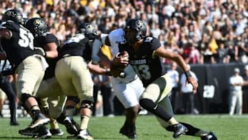 Sep 10, 2016; Boulder, CO, USA; Colorado Buffaloes quarterback Sefo Liufau (13) carries the football in the first half against the Idaho State Bengals at Folsom Field. Mandatory Credit: Ron Chenoy-USA TODAY Sports