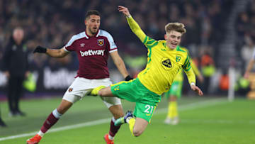 LONDON, ENGLAND - JANUARY 12: Brandon Williams of Norwich City is challenged by Pablo Fornals of West Ham United during the Premier League match between West Ham United and Norwich City at London Stadium on January 12, 2022 in London, England. (Photo by Clive Rose/Getty Images)