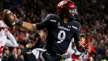 Nov 20, 2021; Cincinnati, Ohio, USA; Cincinnati Bearcats quarterback Desmond Ridder (9) reacts after scoring a touchdown against the Southern Methodist Mustangs in the second half at Nippert Stadium. Mandatory Credit: Katie Stratman-USA TODAY Sports