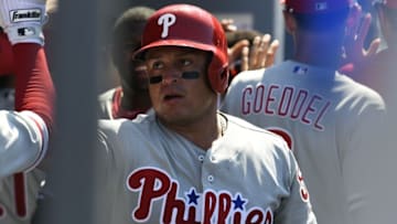 Aug 10, 2016; Los Angeles, CA, USA; Philadelphia Phillies catcher Carlos Ruiz (51) is congratulated in the dugout after scoring in the ninth inning against the Los Angeles Dodgers at Dodger Stadium. Mandatory Credit: Richard Mackson-USA TODAY Sports
