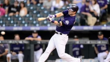 Sep 25, 2015; Denver, CO, USA; Colorado Rockies left fielder Corey Dickerson (6) RBI singles in the first inning against the Los Angeles Dodgers at Coors Field. Mandatory Credit: Ron Chenoy-USA TODAY Sports