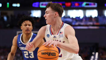 FORT WORTH, TEXAS - MARCH 19: Christian Braun #2 of the Kansas Jayhawks dribbles the ball past Trey Alexander #23 of the Creighton Bluejays in the first half of the game during the second round of the 2022 NCAA Men's Basketball Tournament at Dickies Arena on March 19, 2022 in Fort Worth, Texas. (Photo by Ron Jenkins/Getty Images)