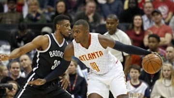 Jan 16, 2016; Atlanta, GA, USA; Atlanta Hawks forward Paul Millsap (4) drives against Brooklyn Nets forward Thaddeus Young (30) in the first quarter at Philips Arena. The Hawks won 114-86. Mandatory Credit: Jason Getz-USA TODAY Sports