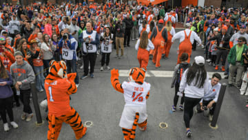 Apr 9, 2022; Clemson, South Carolina, USA; The Tiger and Tiger Cub mascot follow cheerleaders during Tiger Walk before the 2022 Orange vs White Spring Game at Memorial Stadium. Mandatory Credit: Ken Ruinard-USA TODAY Sports
