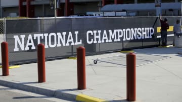 Jan 5, 2017; Tampa, FL, USA; Workers put up signs at Raymond James Stadium where the College Football Championship will be played between the Clemson Tigers and the Alabama Crimson Tide on Monday night. Mandatory Credit: Kim Klement-USA TODAY Sports