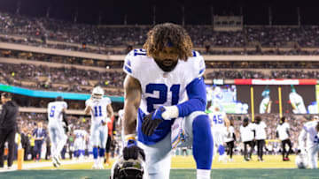 Oct 16, 2022; Philadelphia, Pennsylvania, USA; Dallas Cowboys running back Ezekiel Elliott (21) kneels for action against the Philadelphia Eagles at Lincoln Financial Field. Mandatory Credit: Bill Streicher-USA TODAY Sports