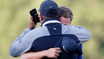 NAPA, CALIFORNIA - SEPTEMBER 29: Cameron Champ hugs his father, Jeff Champ, while on the phone with his grandfather after winning the final round of the Safeway Open at the Silverado Resort on September 29, 2019 in Napa, California. (Photo by Jonathan Ferrey/Getty Images)