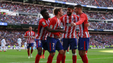 MADRID, SPAIN - APRIL 08: Antoine Griezmann (2ndL) of Atletico de Madrid celebrates scoring their opening goal with teammates Thomas Teye Partey (L), Diego Costa (2ndR) and Lucas Hernandez (R) during the La Liga match between Real Madrid CF and Club Atletico de Madrid at Estadio Santiago Bernabeu on April 8, 2018 in Madrid, Spain. (Photo by Gonzalo Arroyo Moreno/Getty Images)