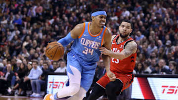 TORONTO, ON - MARCH 25: Tobias Harris #34 of the Los Angeles Clippers dribbles the ball as Fred VanVleet #23 of the Toronto Raptors defends during the first half of an NBA game at Air Canada Centre on March 25, 2018 in Toronto, Canada. NOTE TO USER: User expressly acknowledges and agrees that, by downloading and or using this photograph, User is consenting to the terms and conditions of the Getty Images License Agreement. (Photo by Vaughn Ridley/Getty Images)