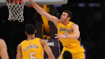 January 5, 2016; Los Angeles, CA, USA; Los Angeles Lakers forward Larry Nance Jr. (7) dunks to score a basket against Golden State Warriors during the first half at Staples Center. Mandatory Credit: Gary A. Vasquez-USA TODAY Sports