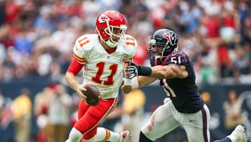 Sep 18, 2016; Houston, TX, USA; Kansas City Chiefs quarterback Alex Smith (11) scrambles out of the pocket as Houston Texans outside linebacker John Simon (51) chases during the fourth quarter at NRG Stadium. The Texans won 19-12. Mandatory Credit: Troy Taormina-USA TODAY Sports