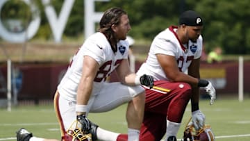 Jul 28, 2016; Richmond, VA, USA; Washington Redskins tight end Logan Paulsen (82) and Redskins tight end Marcel Jensen (83) kneel on the field during drills as part of afternoon practice on day one of training camp at Bon Secours Washington Redskins Training Center. Mandatory Credit: Geoff Burke-USA TODAY Sports