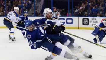 Feb 14, 2016; Tampa, FL, USA; St. Louis Blues defenseman Joel Edmundson (6) defends Tampa Bay Lightning center Steven Stamkos (91) during the second period at Amalie Arena. Mandatory Credit: Kim Klement-USA TODAY Sports