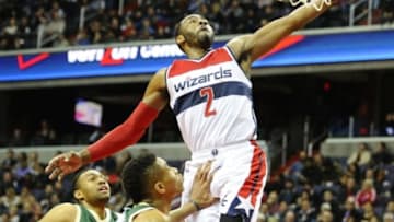 Jan 13, 2016; Washington, DC, USA; Washington Wizards guard John Wall (2) dunks the ball against the Milwaukee Bucks during the second half at Verizon Center. Washington won 106-101. Mandatory Credit: Brad Mills-USA TODAY Sports
