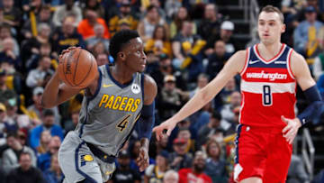 INDIANAPOLIS, IN - DECEMBER 23: Victor Oladipo #4 of the Indiana Pacers leads a fast break ahead of Sam Dekker #8 of the Washington Wizards during the game at Bankers Life Fieldhouse on December 23, 2018 in Indianapolis, Indiana. The Pacers won 105-89. NOTE TO USER: User expressly acknowledges and agrees that, by downloading and or using the photograph, User is consenting to the terms and conditions of the Getty Images License Agreement. (Photo by Joe Robbins/Getty Images)