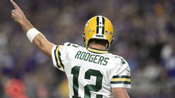 MINNEAPOLIS, MN - SEPTEMBER 18: Quarterback Aaron Rodgers #12 of the Green Bay Packers signals for a first down during their game against the Minnesota Vikings on September 18, 2016 at US Bank Stadium in Minneapolis, Minnesota. (Photo by Hannah Foslien/Getty Images)