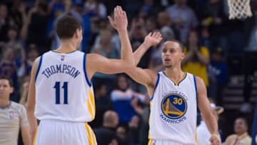 January 2, 2015; Oakland, CA, USA; Golden State Warriors guard Stephen Curry (30) celebrates with guard Klay Thompson (11) against the Toronto Raptors during the fourth quarter at Oracle Arena. The Warriors defeated the Raptors 126-105. Mandatory Credit: Kyle Terada-USA TODAY Sports