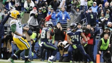 Jan 18, 2015; Seattle, WA, USA; Seattle Seahawks running back Marshawn Lynch (24) scores a go ahead touchdown during the fourth quarter against the Green Bay Packers in the NFC Championship Game at CenturyLink Field. Mandatory Credit: Steven Bisig-USA TODAY Sports
